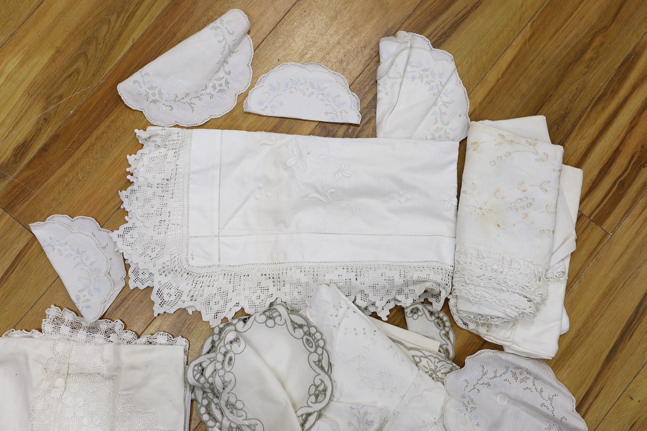 A collection of cut work and crochet edged table linens